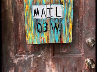 multi-coloured-wooden-mailbox-mounted-on-door-979959.jpg