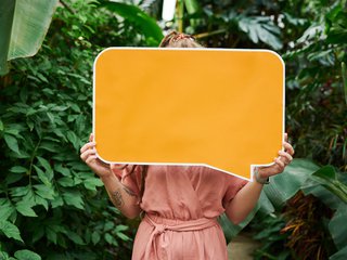 photo-of-woman-holding-sign-board-3228829.jpg