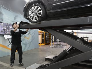 serious-mechanic-checking-car-wheels-on-lift-in-modern-car-3807799.jpg