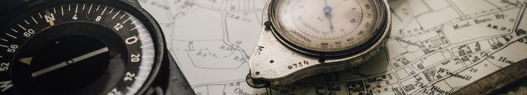 shallow-focus-photography-of-black-and-silver-compasses-on-1203808.jpg